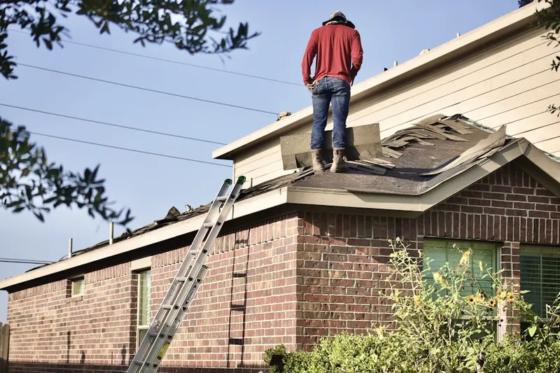Professional roofer working on a residential roof in Chesapeake Acres